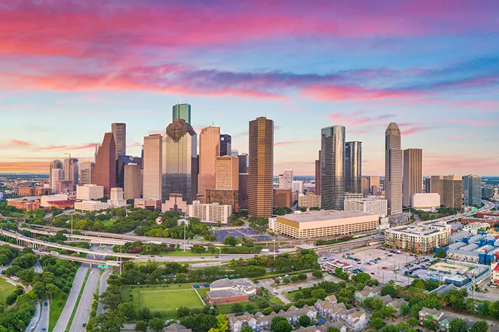 Houston, TX skyline at dawn.